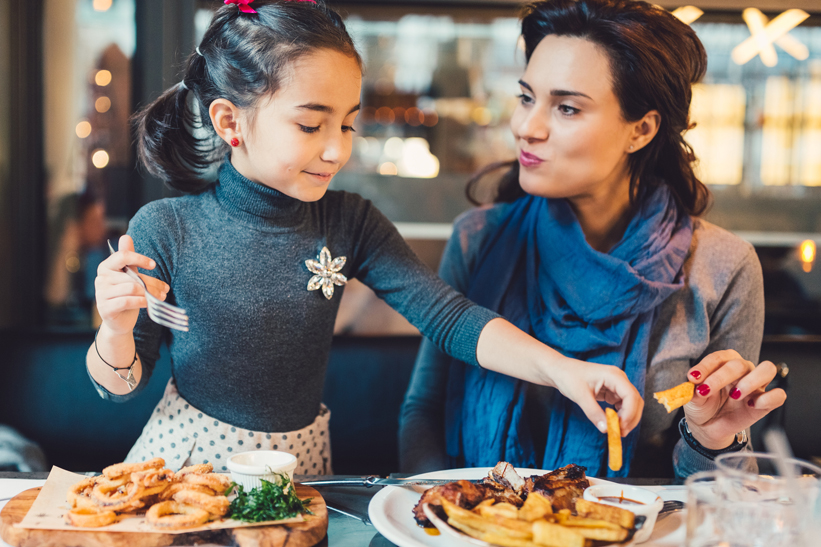 Mother and daughter in restaurant